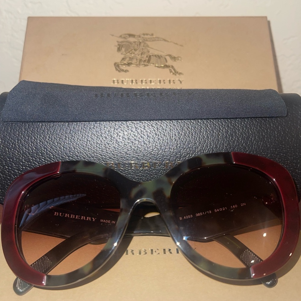Authentic Burberry sunglasses, new, left lens has a small scratch.
